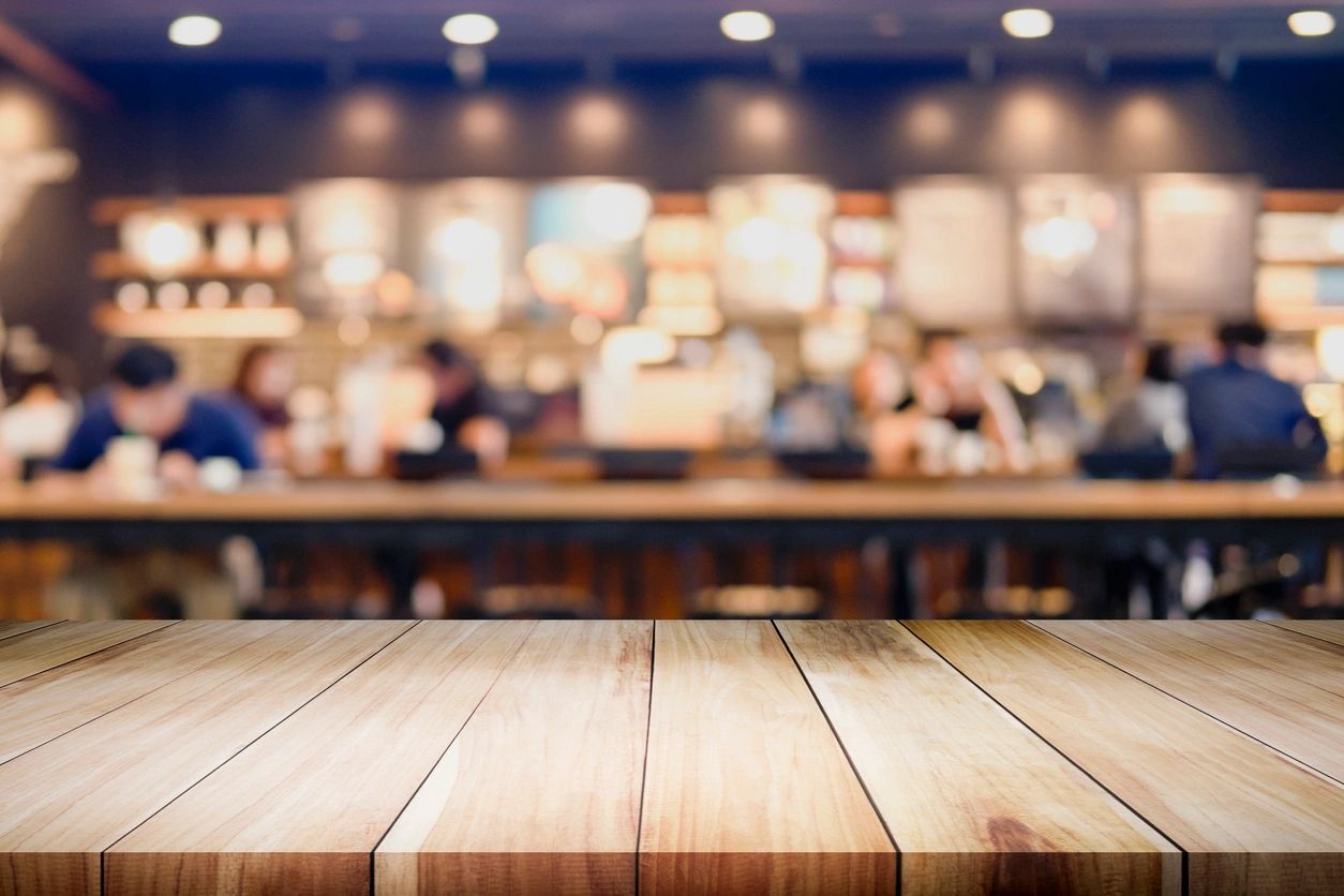 Warm café interior with wooden table